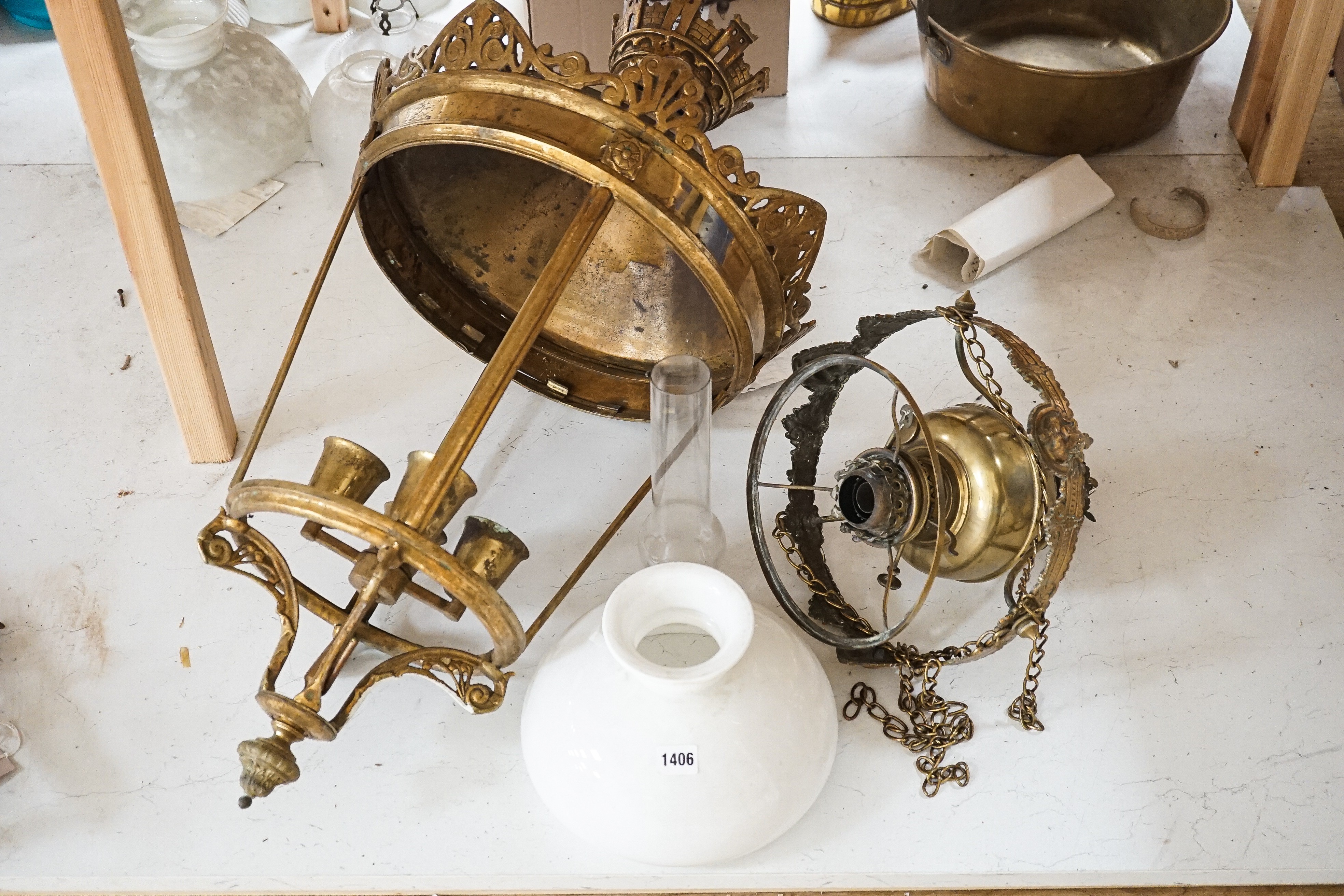 An Edwardian brass hanging oil lamp with opaque shade, overall drop 80cm Together with a large brass hall lantern